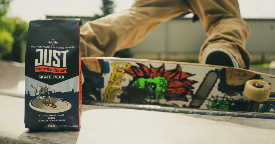Box of Just Coffee with a skateboarder in the background